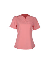 Pink polo shirt on a white background